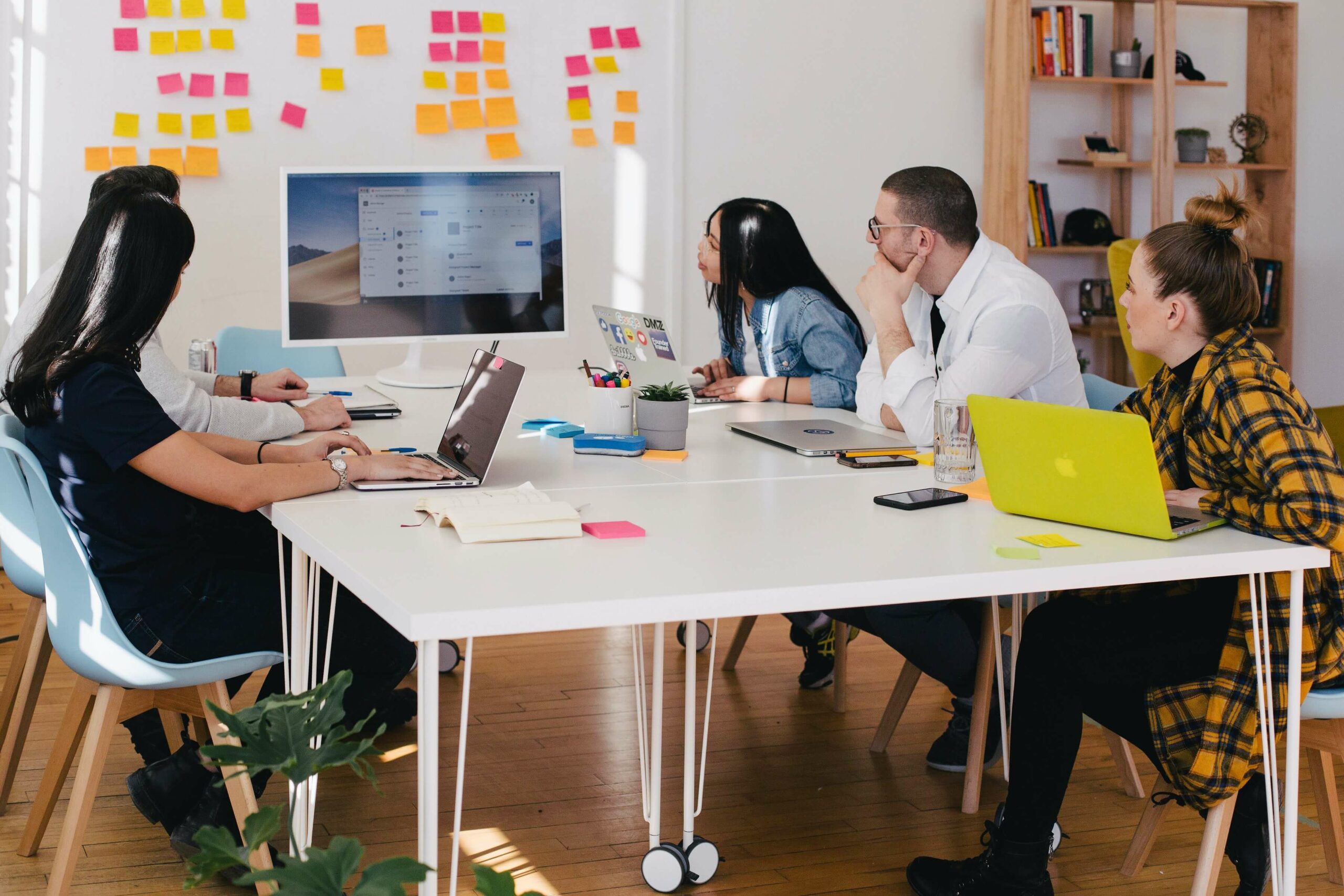 team looking at a computer screen during a meeting