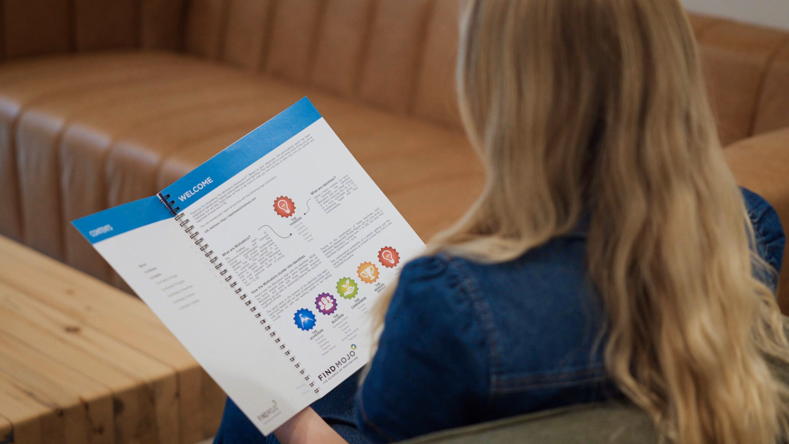 Woman viewing her FindMojo motivation assessment results, symbolizing self-discovery, personal growth, and career development.