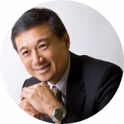 Profile of a professional man with his hands clasped.